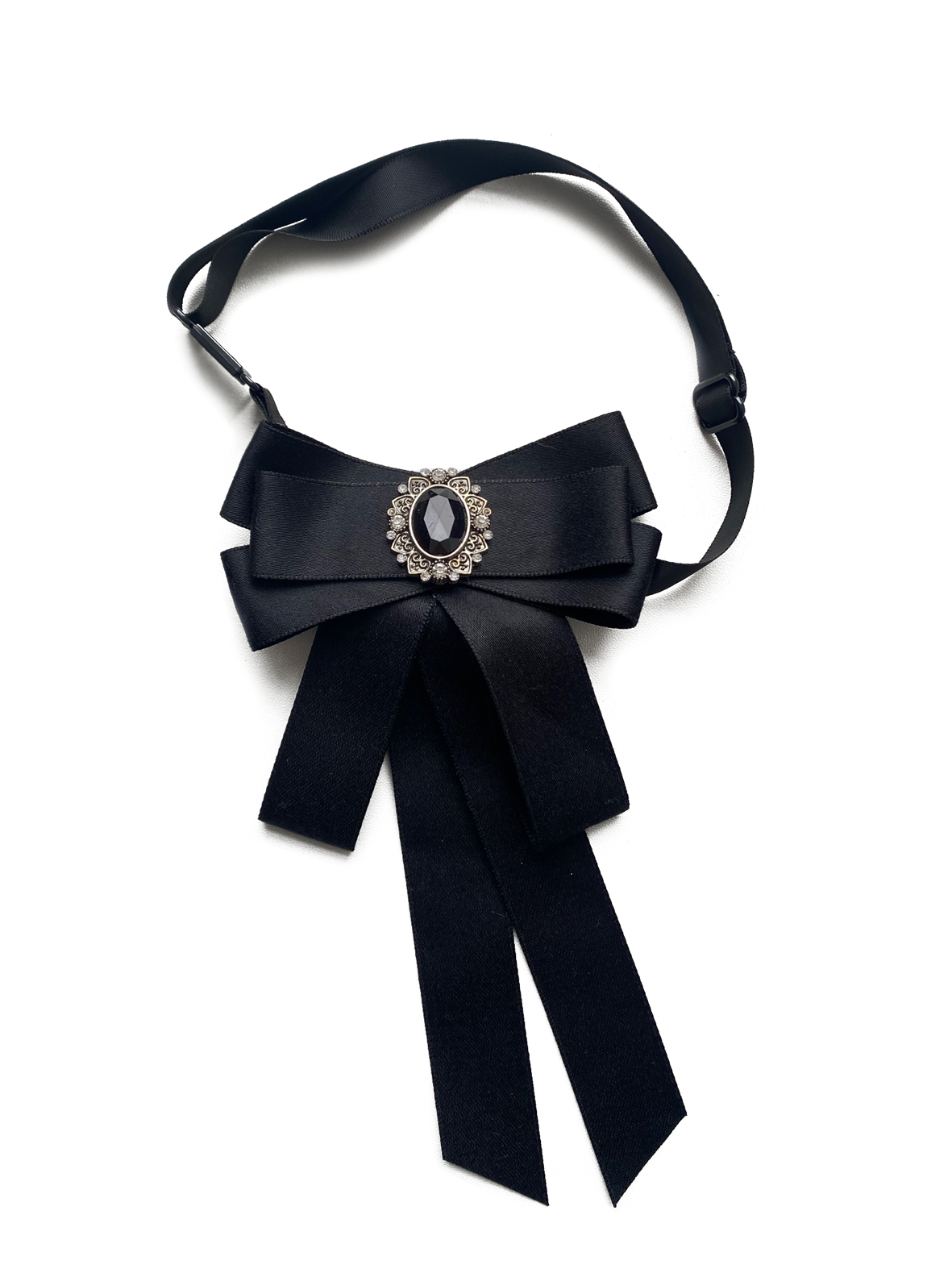 Bow with brooch